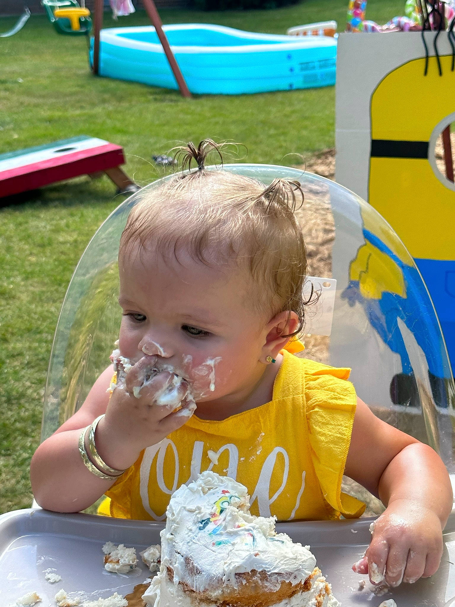 Aurora is registered to the contest to win money with this photo: baby, baked_goods, birthday_cake, chair, child, dessert, event, food, fun, grass, green, icing, leisure, person, plate, recreation, sharing, summer, sweetness, tableware