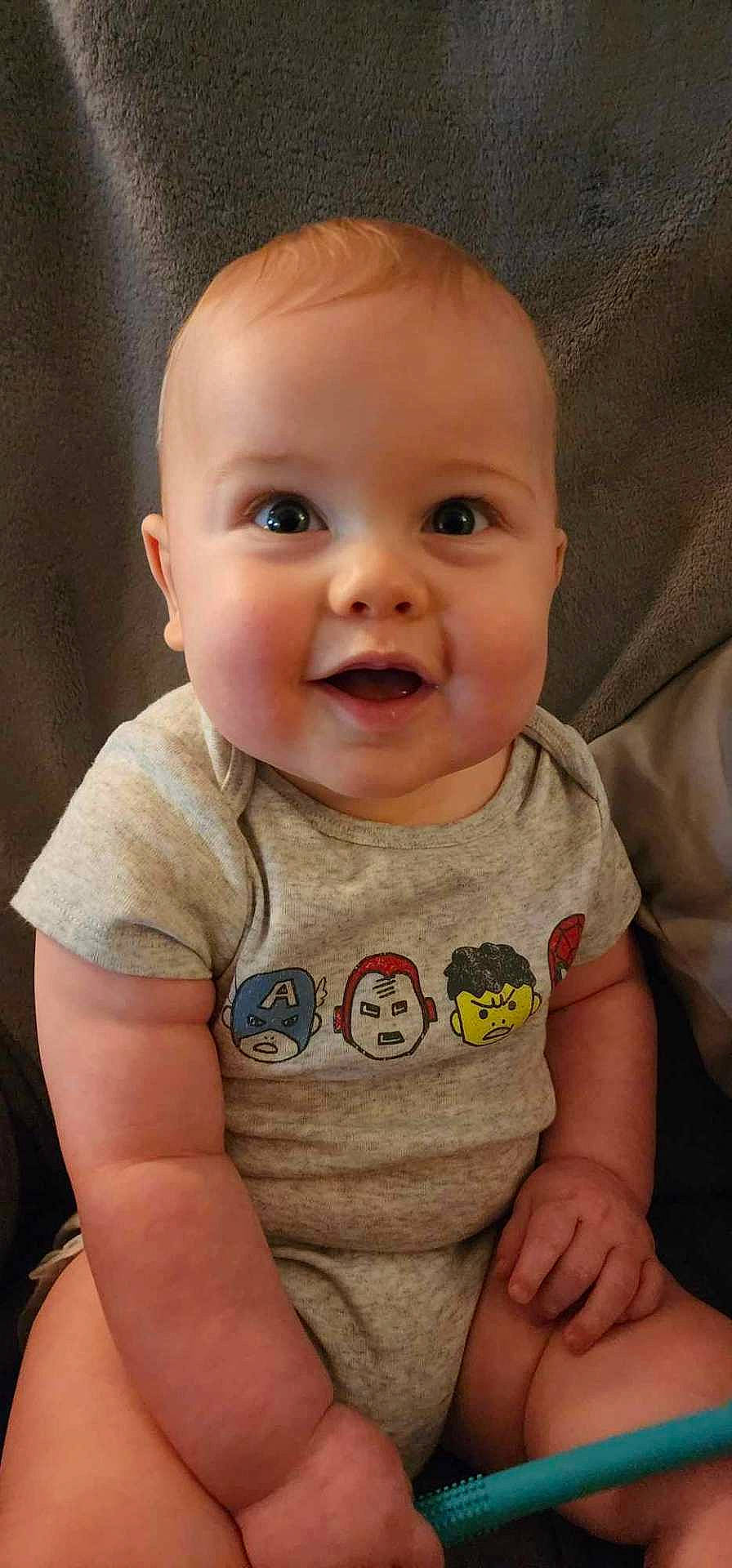 Fin joined the competition — help win amazing prizes! accessories, baby, babylaughing, bodypart, clothing, face, happy, head, jewelry, laughing, mouth, necklace, newborn, person, photography, portrait, sitting, smile, t_shirt, teeth