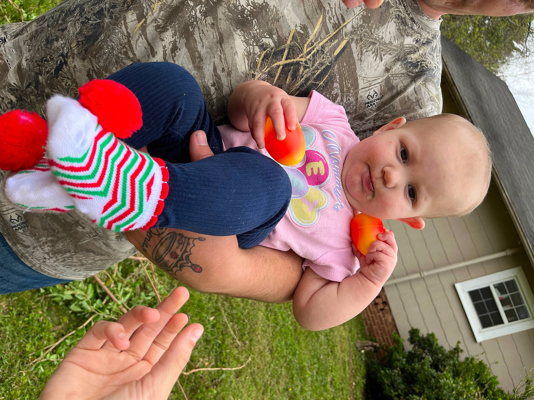 Belle joined the competition — help win amazing prizes! baby, child, finger, fun, grass, hand, happy, human_body, interaction, leaf, leg, leisure, people_in_nature, person, pink, plant, red, summer, thigh, toddler