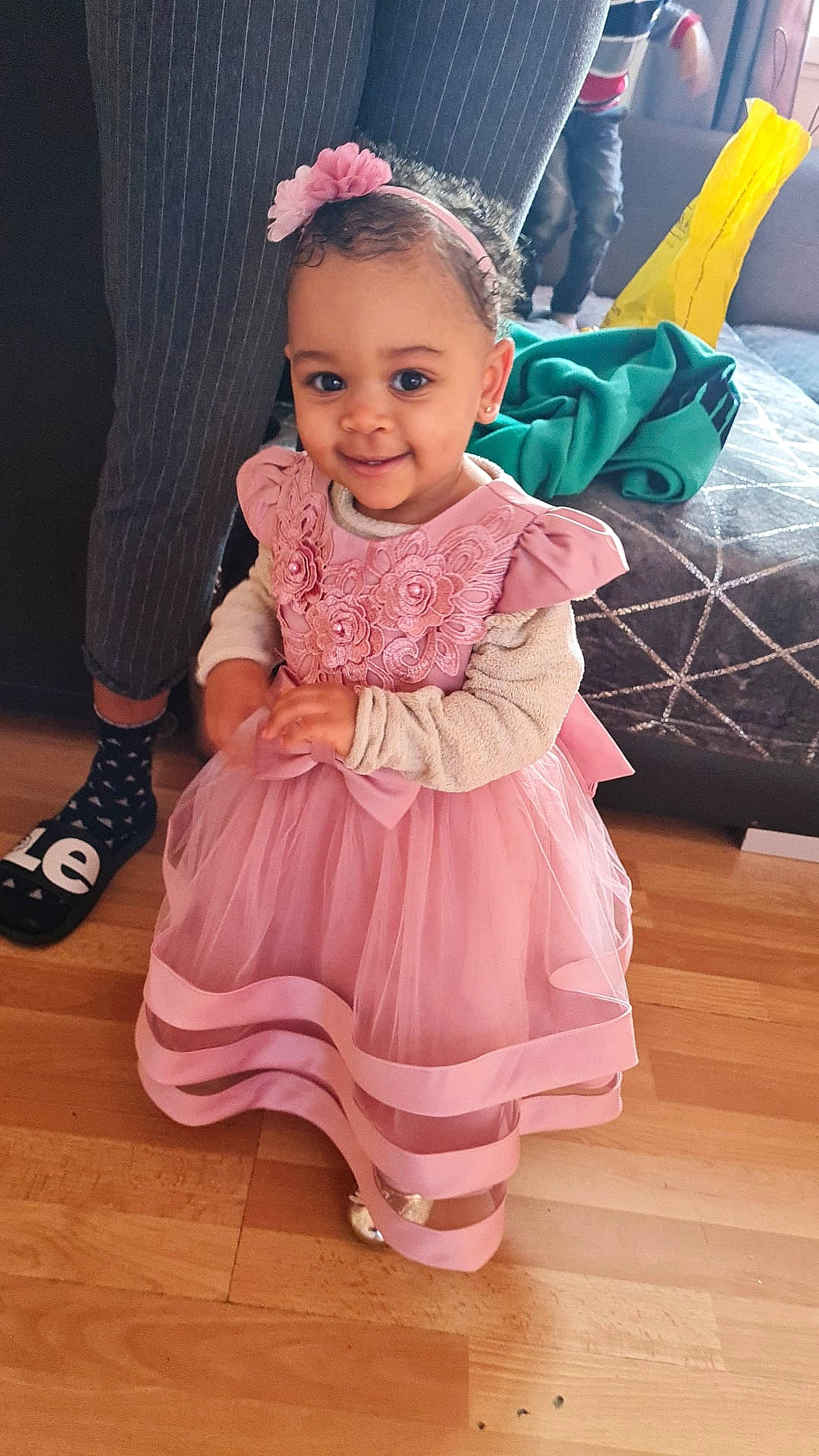 Iris participe au concours pour gagner de l'argent avec cette photo : baby_toddler_clothing, child, day_dress, dress, embellishment, facial_expression, flooring, fun, happy, hardwood, iris, joy, magenta, pattern, person, pink, purple, skin, sleeve, smile