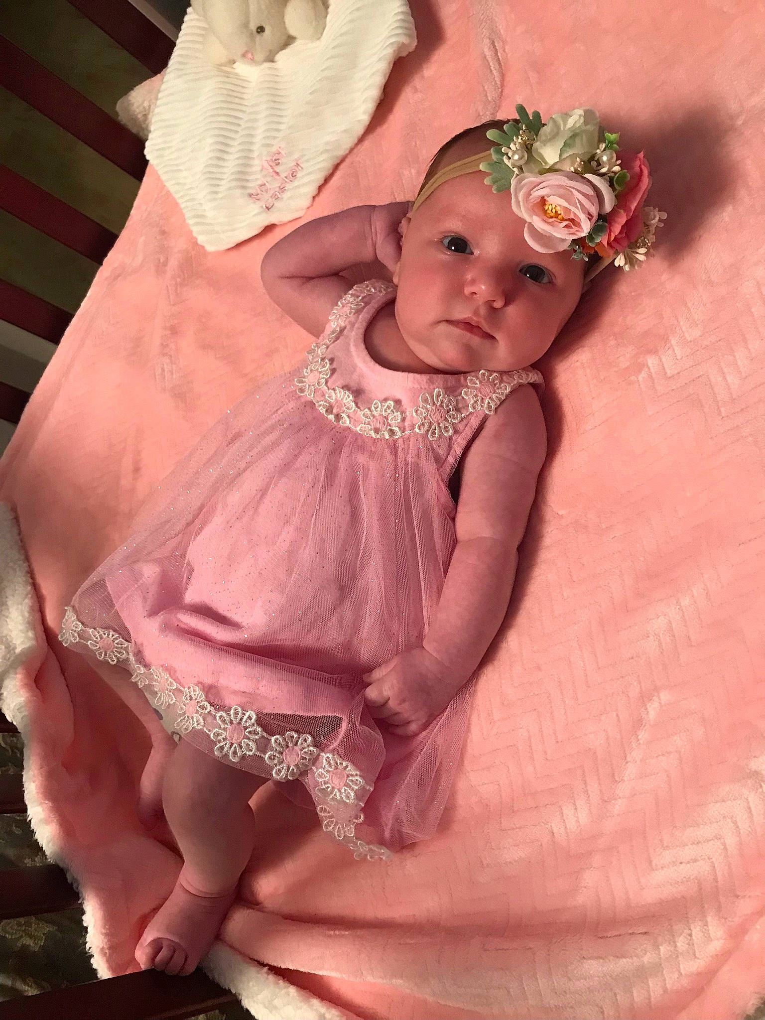 Sage joined the competition — help win amazing prizes! arm, baby, baby_toddler_clothing, day_dress, dress, embellishment, flower, hand, hat, headgear, headpiece, headwear, human_body, leg, peach, person, petal, pink, ruffle, skin