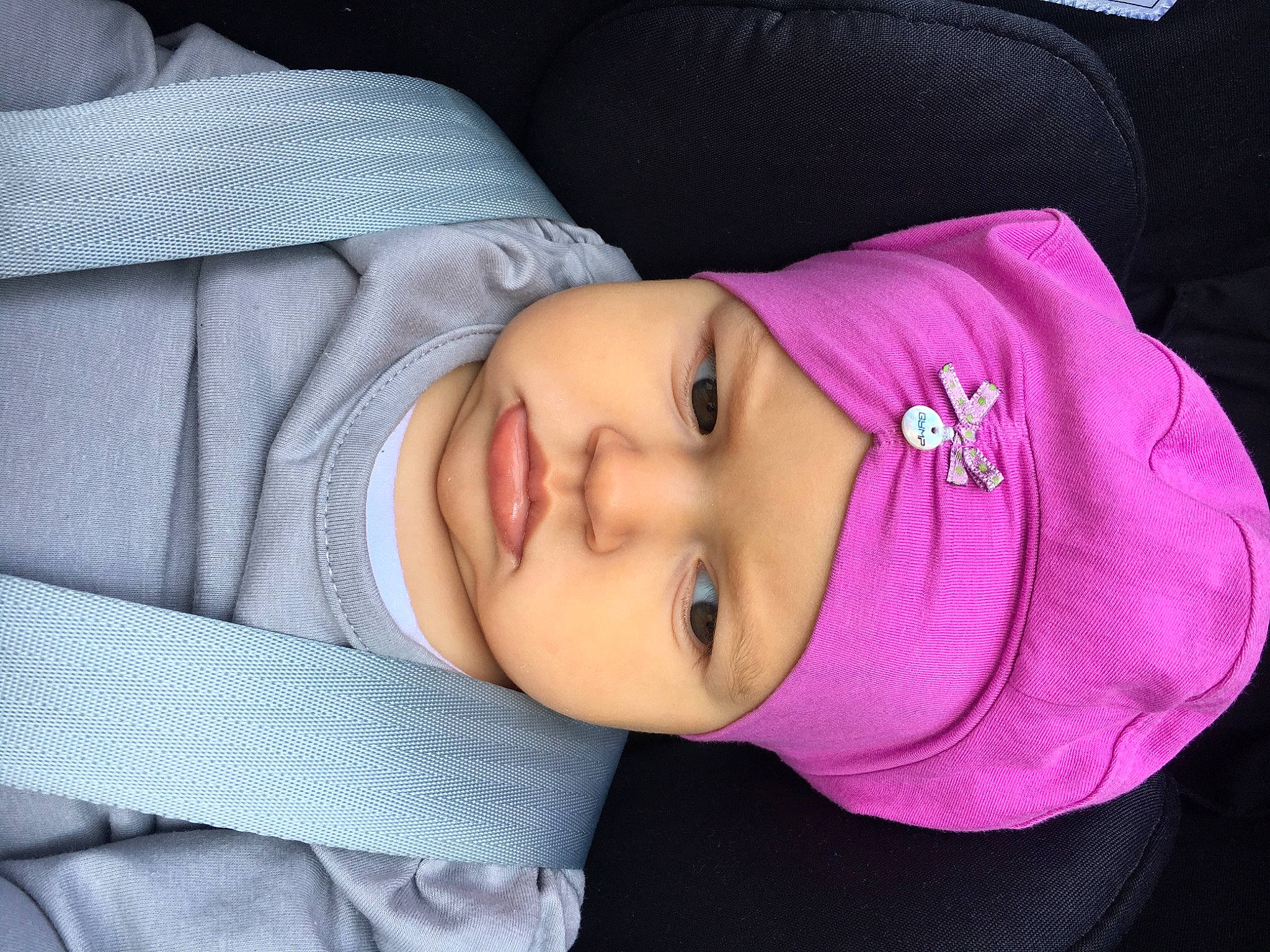 Ina participe au concours pour gagner de l'argent avec cette photo : arm, baby, beauty, cheek, child, chin, eye, eyebrow, face, forehead, head, headwear, lip, mouth, nap, nose, person, pink, purple, skin