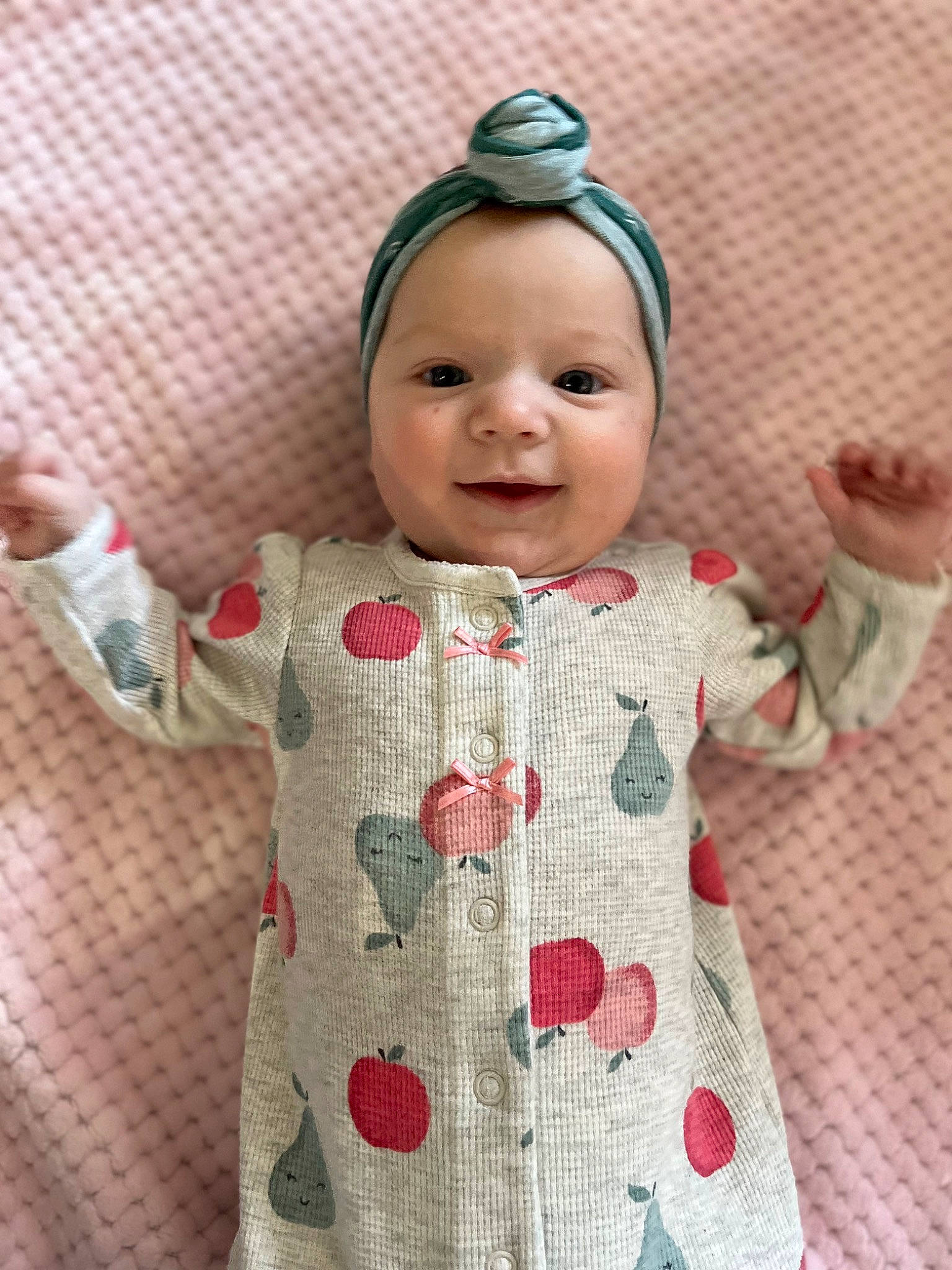 Charley is registered to the contest to win money with this photo: baby, baby_toddler_clothing, cheek, child, face, fashion_accessory, happy, headwear, joy, linens, lip, pattern, person, pink, plaid, product, skin, sleeve, smile, t_shirt