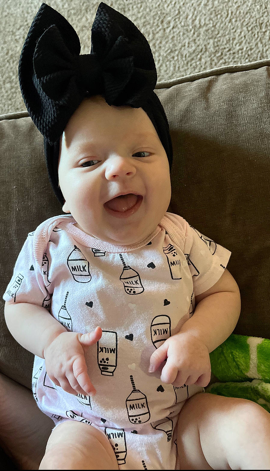 Charley is registered to the contest to win money with this photo: baby, baby_toddler_clothing, cheek, chin, comfort, eye, face, facial_expression, happy, head, lip, mammal, nose, outerwear, person, product, skin, sleeve, smile, textile