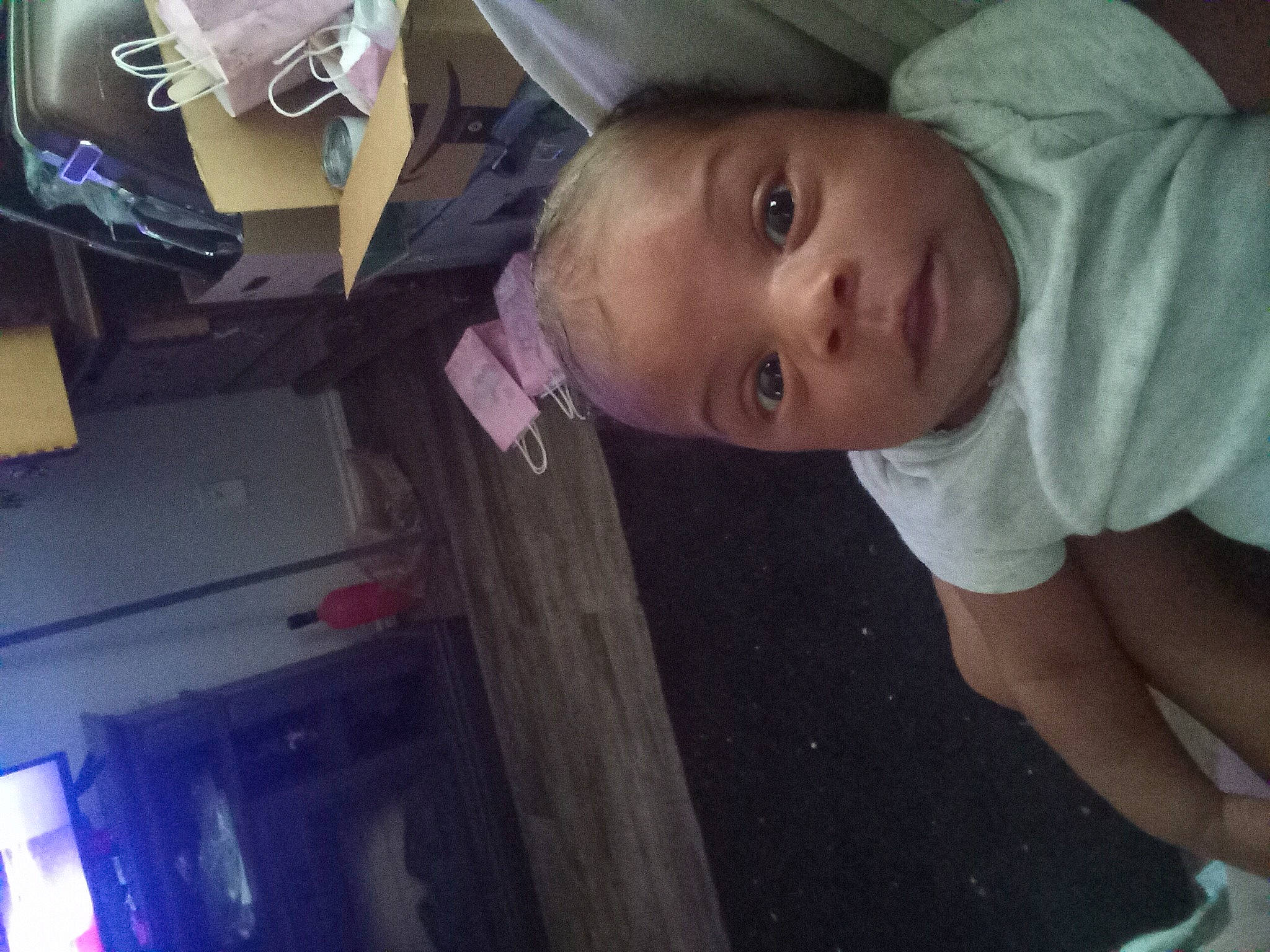 Aria is registered to the contest to win money with this photo: auto_part, baby, cheek, chest, child, elbow, fun, hat, mouth, nose, organ, person, room, sitting, sleeve, t_shirt, toddler