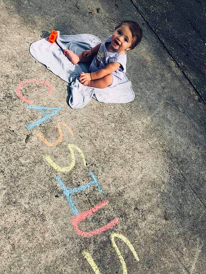 Cassius is registered to the contest to win money with this photo: asphalt, chalk, child, concrete, jeans, person, play, road_surface, sidewalk