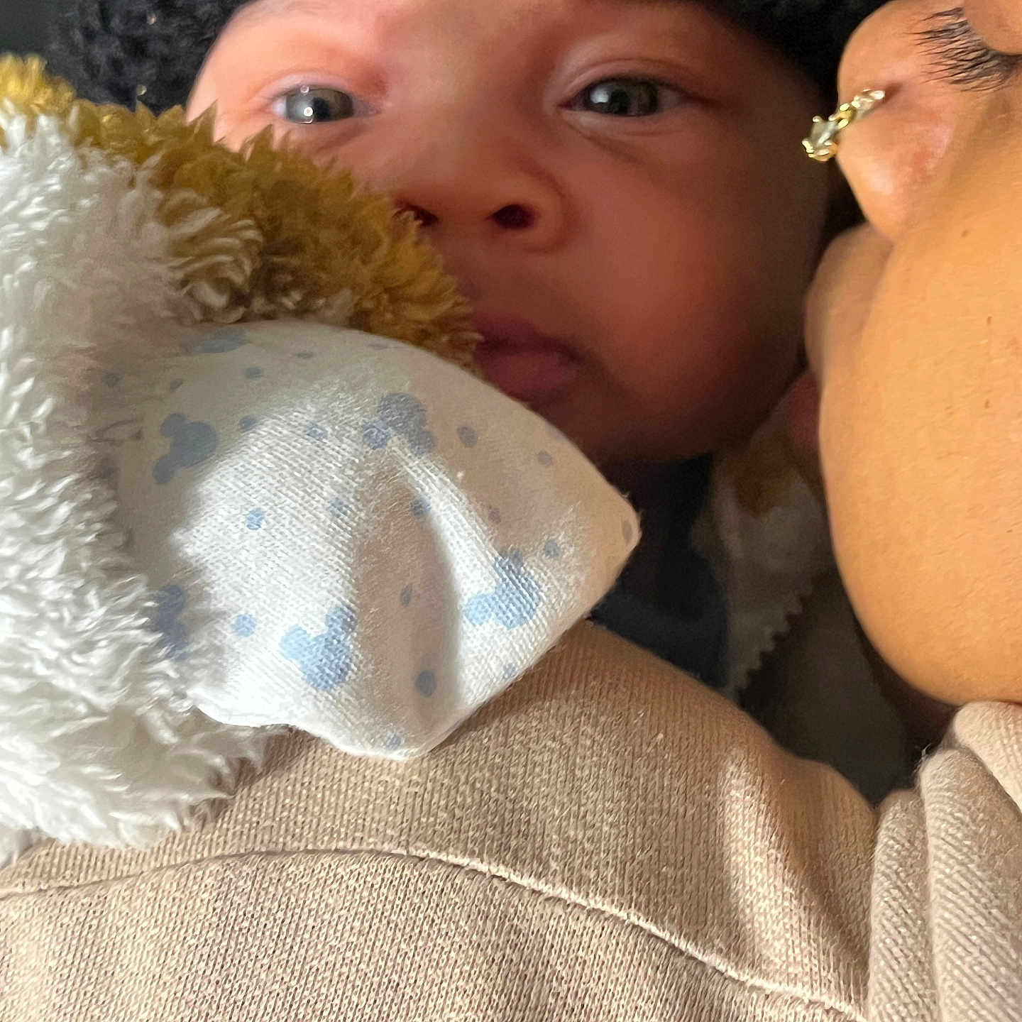 Jaxani joined the competition — help win amazing prizes! baby, child, infant, hat, blanket, close_up, face, person, adult, affection, cozy, warm, nose, eyelashes, skin, clothing, texture, intimate, portrait, indoor