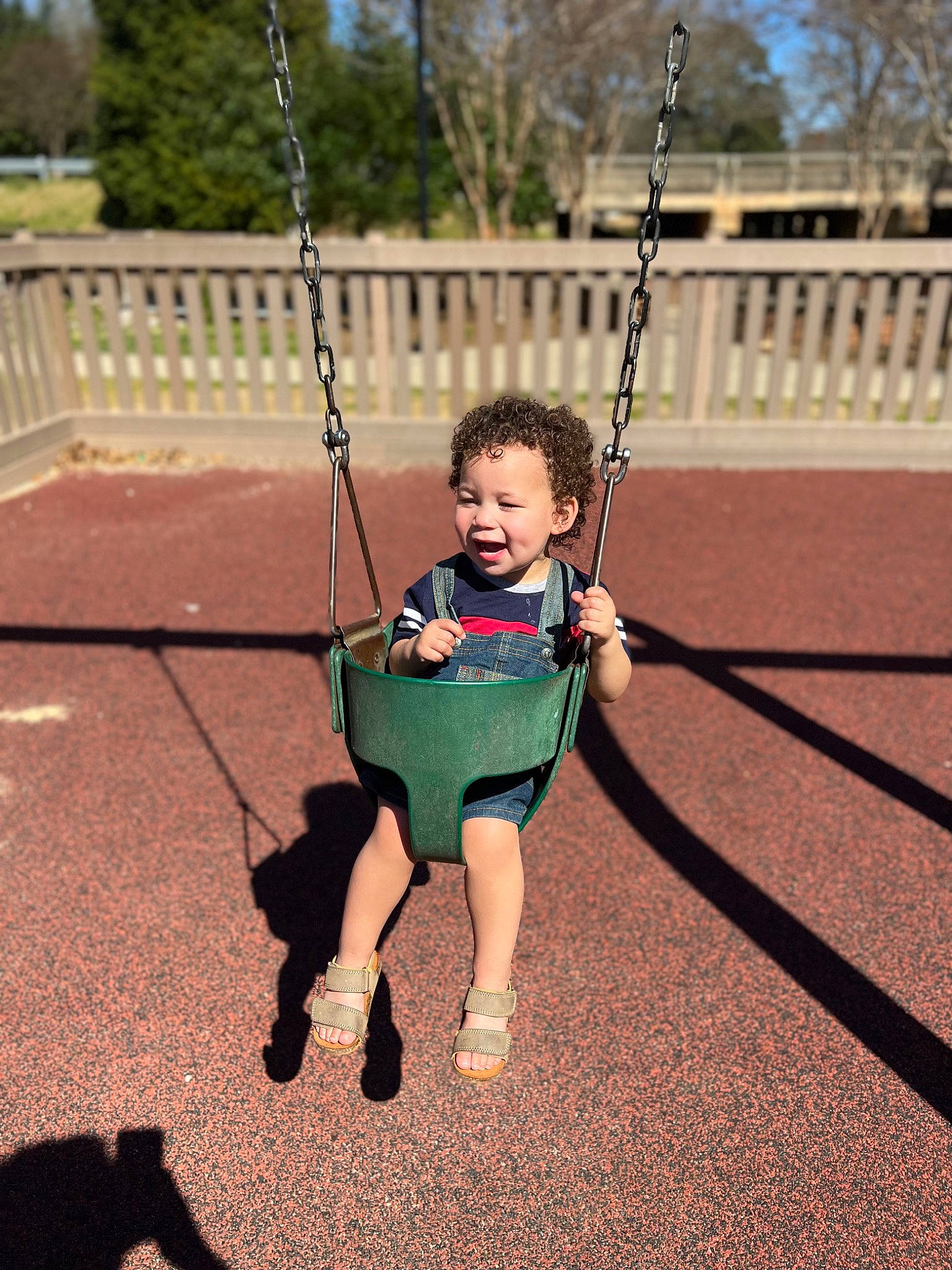 Bentley joined the competition — help win amazing prizes! baby, city, electric_blue, face, fun, grass, happy, human_settlement, leisure, people_in_nature, person, plant, play, playground, public_space, recreation, smile, swing, toddler, tree