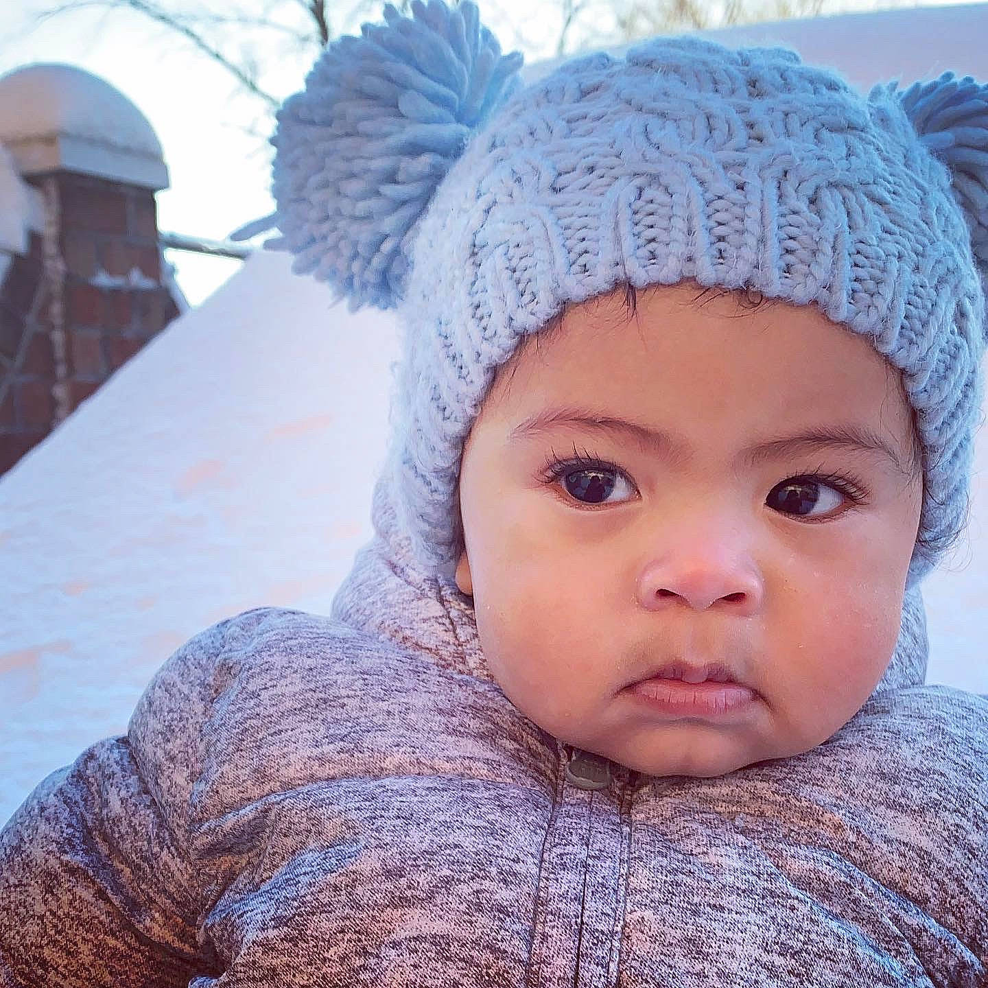 Jem is registered to the contest to win money with this photo: baby_toddler_clothing, bonnet, cheek, child, close_up, eyebrow, eyelash, forehead, headgear, headwear, hoodie, iris, knit_cap, knitting, lip, person, photography, skin, textile, winter