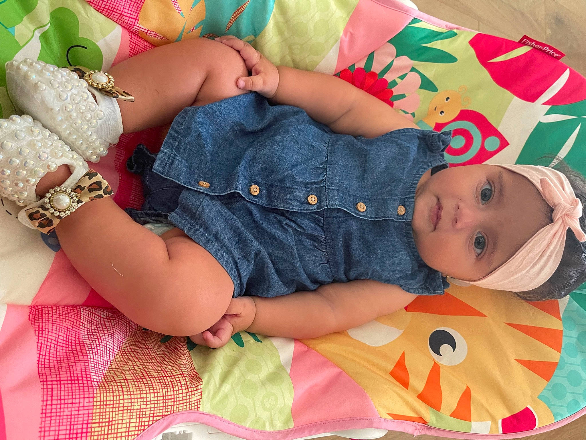 Fatima is registered to the contest to win money with this photo: baby, baby_products, baby_toddler_clothing, cheek, child, comfort, face, finger, green, hand, headwear, nail, orange, pattern, person, pink, skin, sleeve, thigh, toddler