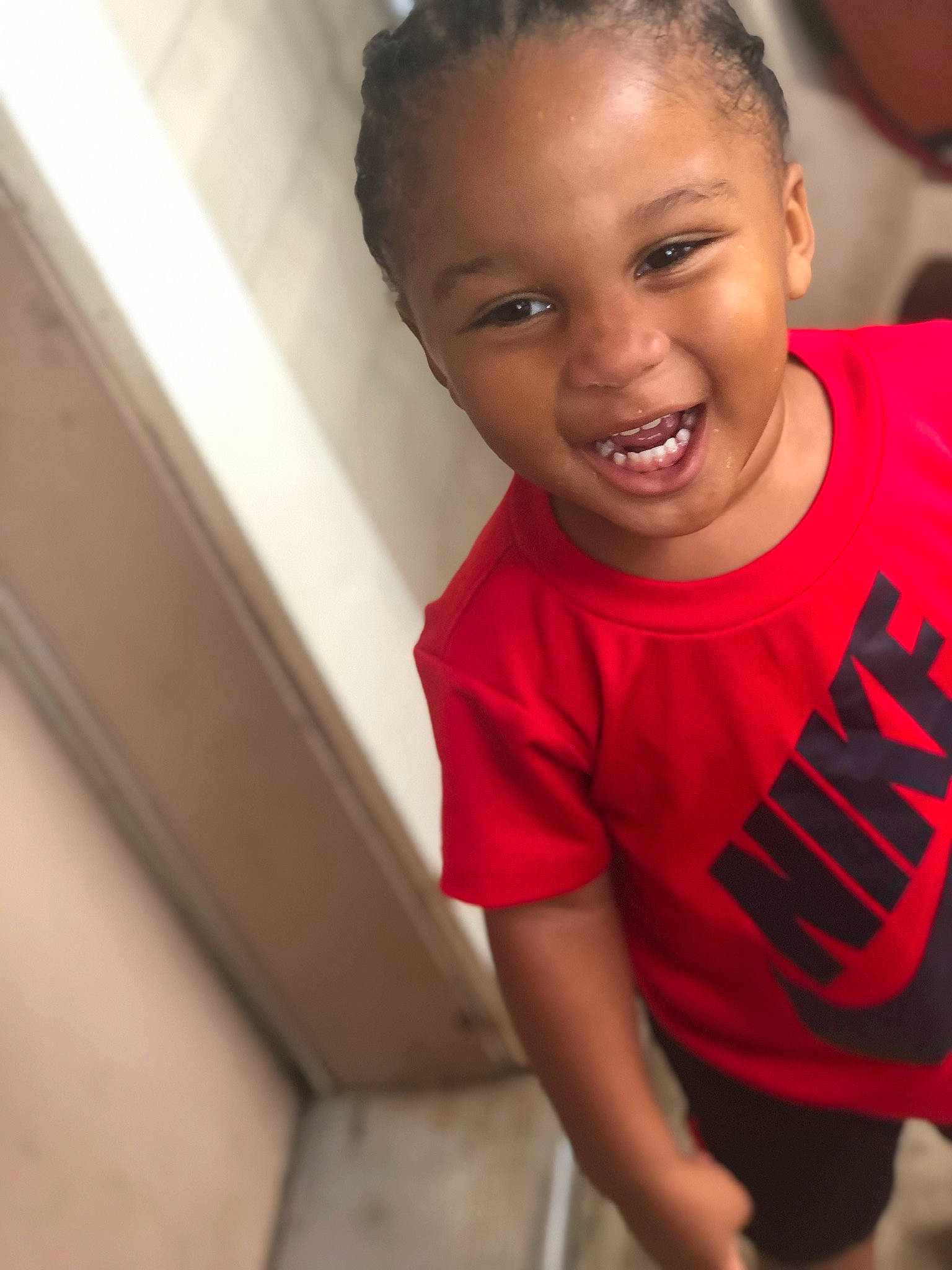 Brysten is registered to the contest to win money with this photo: cheek, child, chin, face, facial_expression, forehead, fun, happy, head, joy, laugh, lip, male, mouth, nose, person, skin, smile, standing, t_shirt