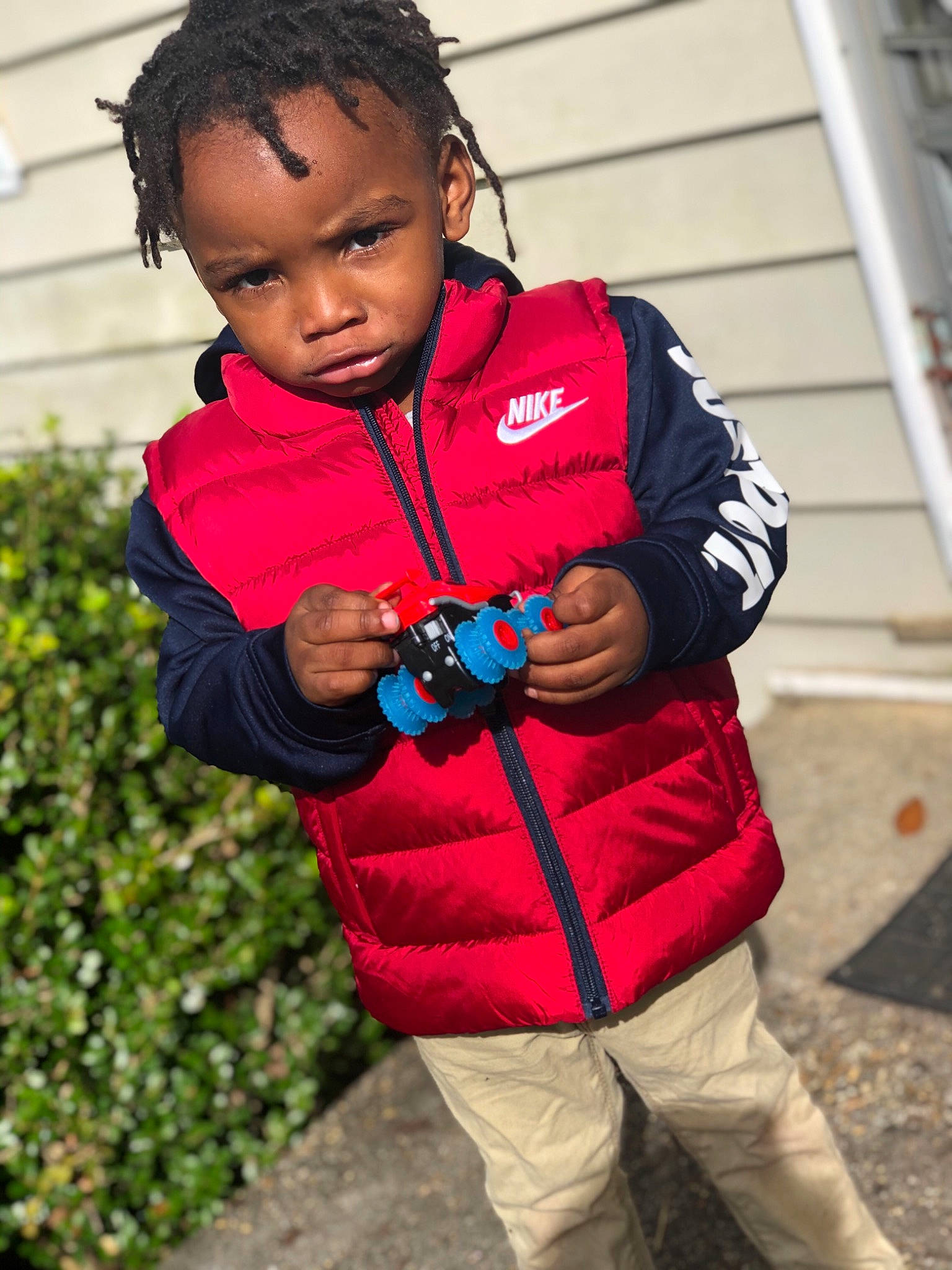 Travon joined the competition — help win amazing prizes! child, fun, jacket, outerwear, person, plant, play, red, smile, toddler, vacation