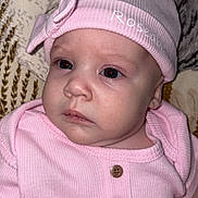 Roseabella joined the competition — help win amazing prizes! baby, infant, hat, pink_clothing, bow, face, portrait, closeup, child, newborn, buttoned_shirt, cute, soft_lighting, indoor, expression, lying_down, blanket, texture, apparel, person