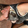 Roadie is registered to the contest to win money with this photo: affection, casual, cat, closeup, comfort, couch, domestic, earring, friendship, fur, home, human, indoor, paw, person, pet, relaxing, resting, snuggling, striped_clothing