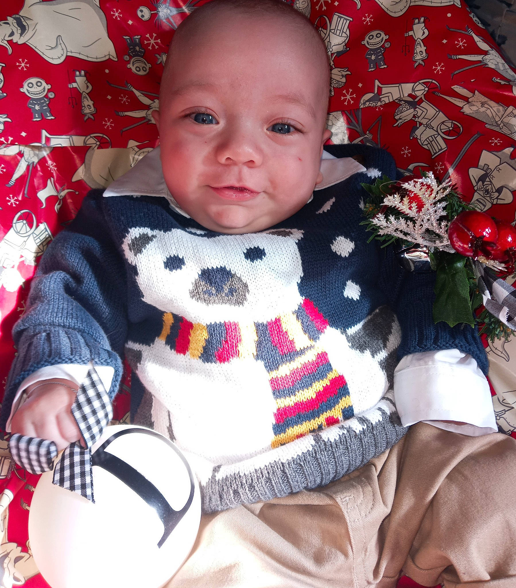 Declan is registered to the contest to win money with this photo: baby, baby_products, baby_toddler_clothing, cheek, child, collar, comfort, dress, eye, happy, head, human_body, iris, linens, pattern, person, skin, sleeve, t_shirt, textile