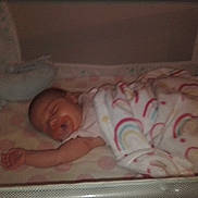 Willow is registered to the contest to win money with this photo: baby, bed, bedroom, blanket, cradle, crib, face, furniture, head, indoors, infantbed, person, room