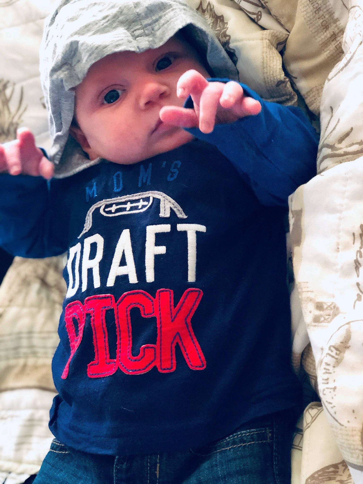 Xavier is registered to the contest to win money with this photo: boy, child, cool, fun, headwear, jeans, outerwear, person, product, sleeve, t_shirt, textile, toddler