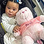 Kataleya is registered to the contest to win money with this photo: baby, infant, child, stroller, car_seat, teddy_bear, plush_toy, pink, bows, hair, blanket, white_sweater, holding, shopping, store_shelf, cute, portrait, hand, face, eyes