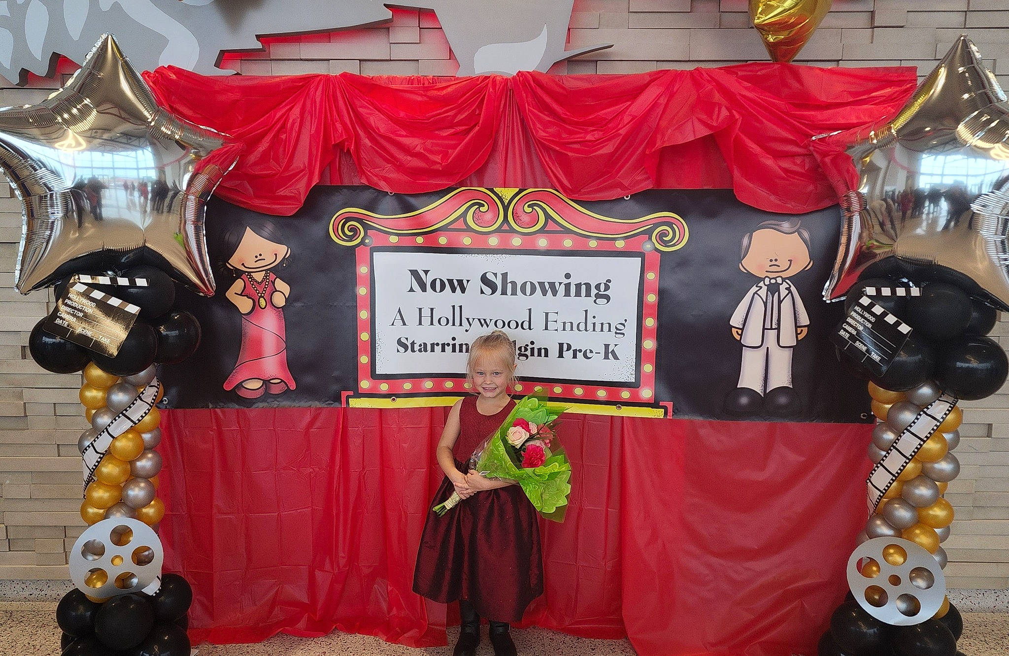 Oaklynn joined the competition — help win amazing prizes! advertising, banner, chair, curtain, decoration, entertainment, event, flooring, font, heater, joy, performance, performing_arts, person, public_event, red, stage, stage_equipment, textile, theatrical_property