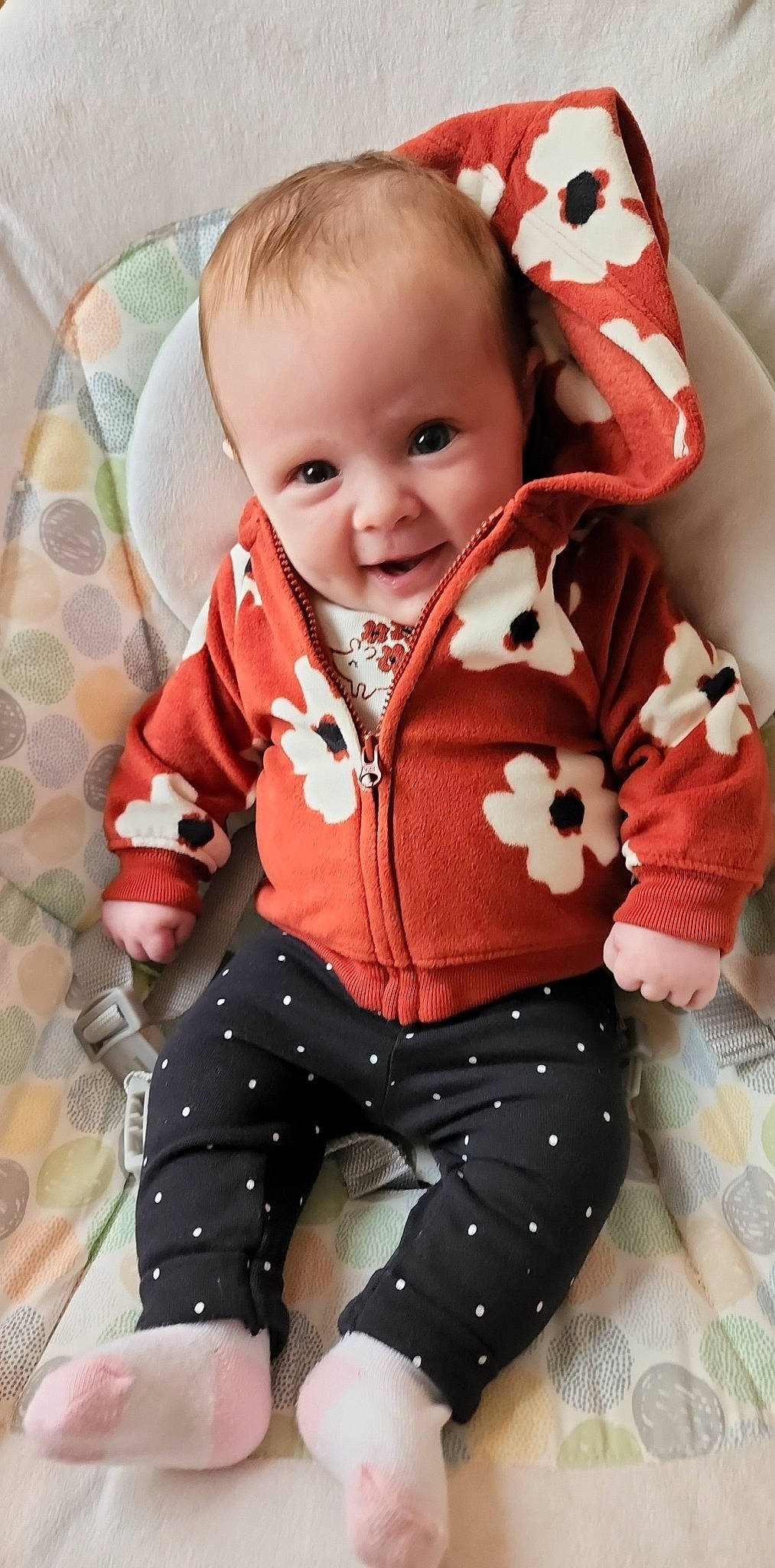 Raycelynn is registered to the contest to win money with this photo: baby, baby_toddler_clothing, cheek, collar, comfort, eye, face, happy, head, human_body, neck, orange, outerwear, person, product, skin, sleeve, smile, textile, toddler