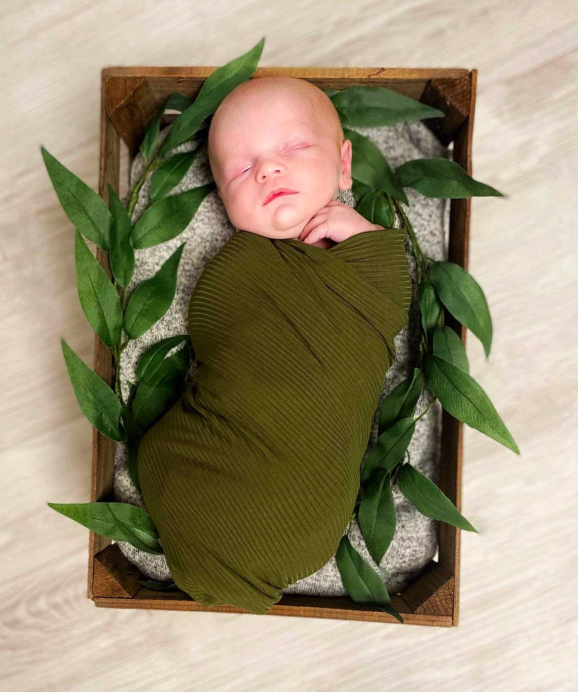Ivan is registered to the contest to win money with this photo: baby, baby_toddler_clothing, child, comfort, floral_design, grass, linens, paper, paper_product, person, plant, plant_stem, rose_order, sitting, sleeve, terrestrial_plant, toddler, twig, wood