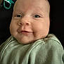 baby, infant, smile, face, cheeks, clothing, green_outfit, pacifier, closeup, portrait, child, cute, happy, skin, head, eyes, newborn, soft_light, indoor, babywear