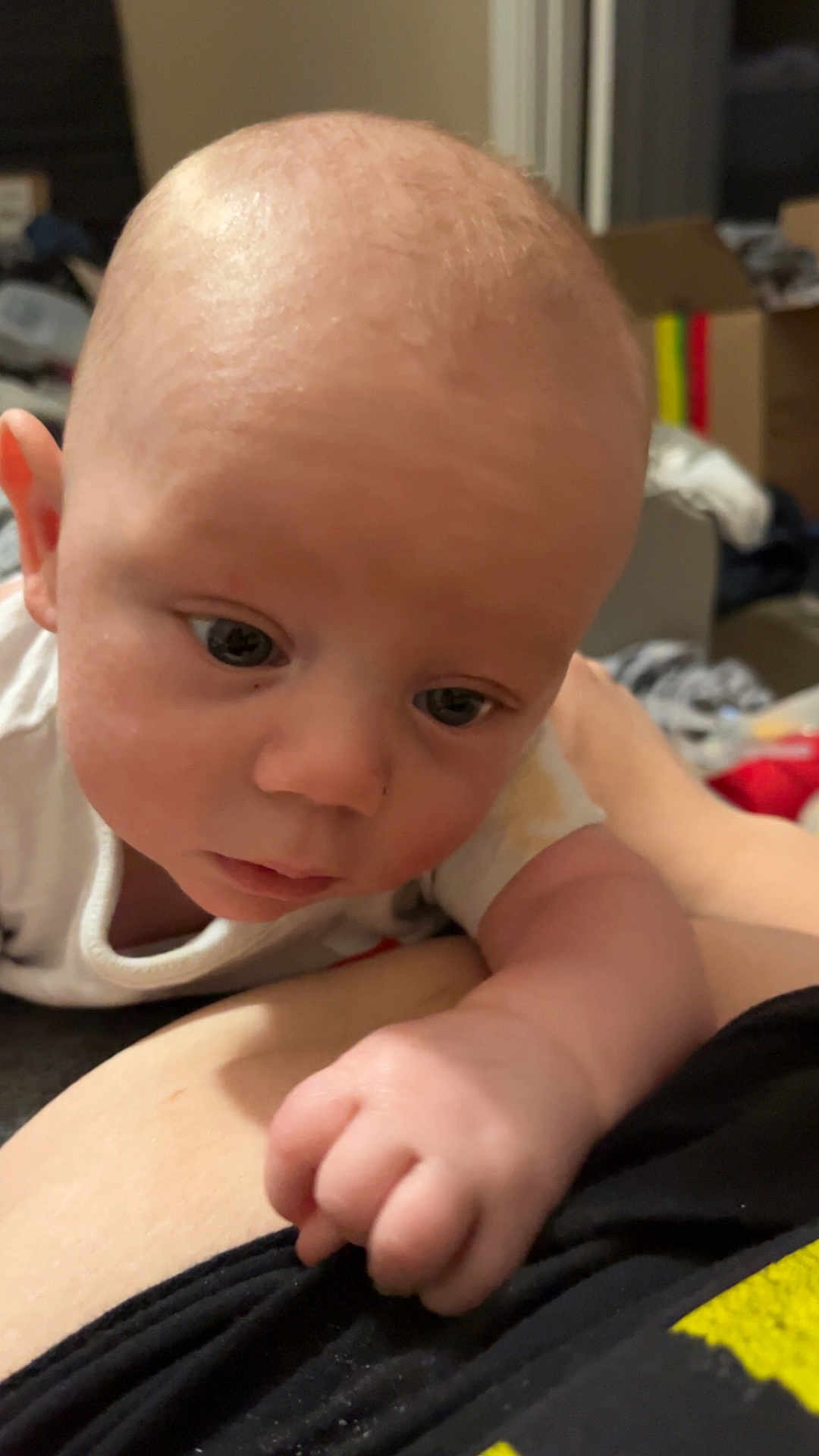 Laykan joined the competition — help win amazing prizes! baby, infant, close_up, face, hand, curious, indoors, person, skin, expression, clothing, young_child, child, exploration, background, casual, real_life, portrait, human, toddler