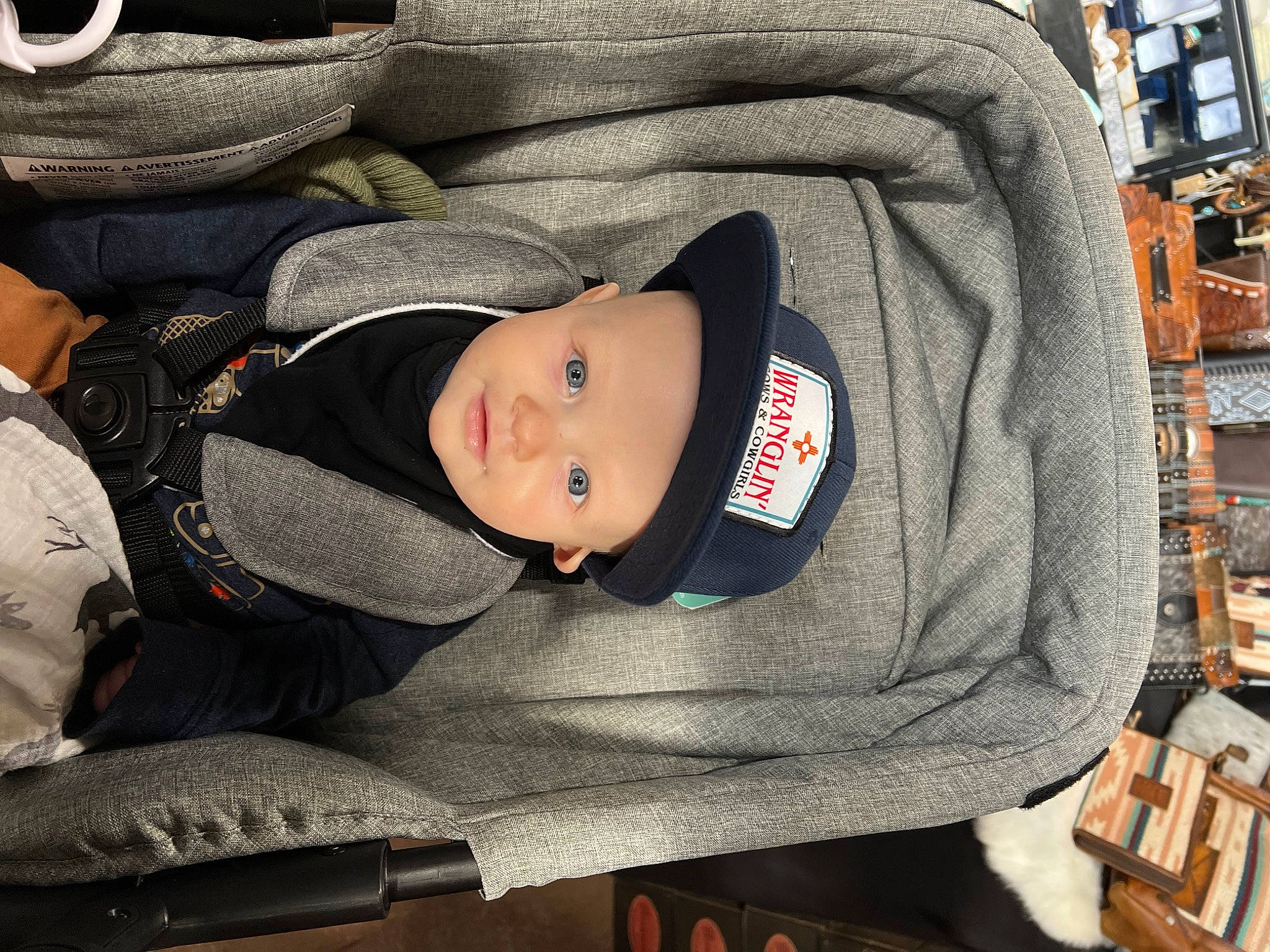 Anthony joined the competition — help win amazing prizes! auto_part, baby, baby_carriage, baby_products, baby_toddler_clothing, car_seat, child, comfort, headgear, headwear, motor_vehicle, person, sitting, toddler, tree, winter