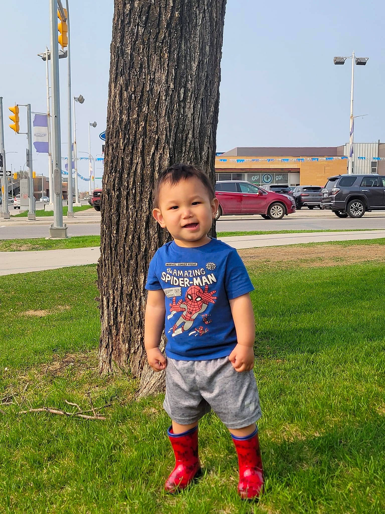Colton joined the competition — help win amazing prizes! car, child, fun, grass, grass_family, grassland, happy, human_body, leg, leisure, people_in_nature, person, plant, shorts, sky, t_shirt, tire, toddler, tree, truck