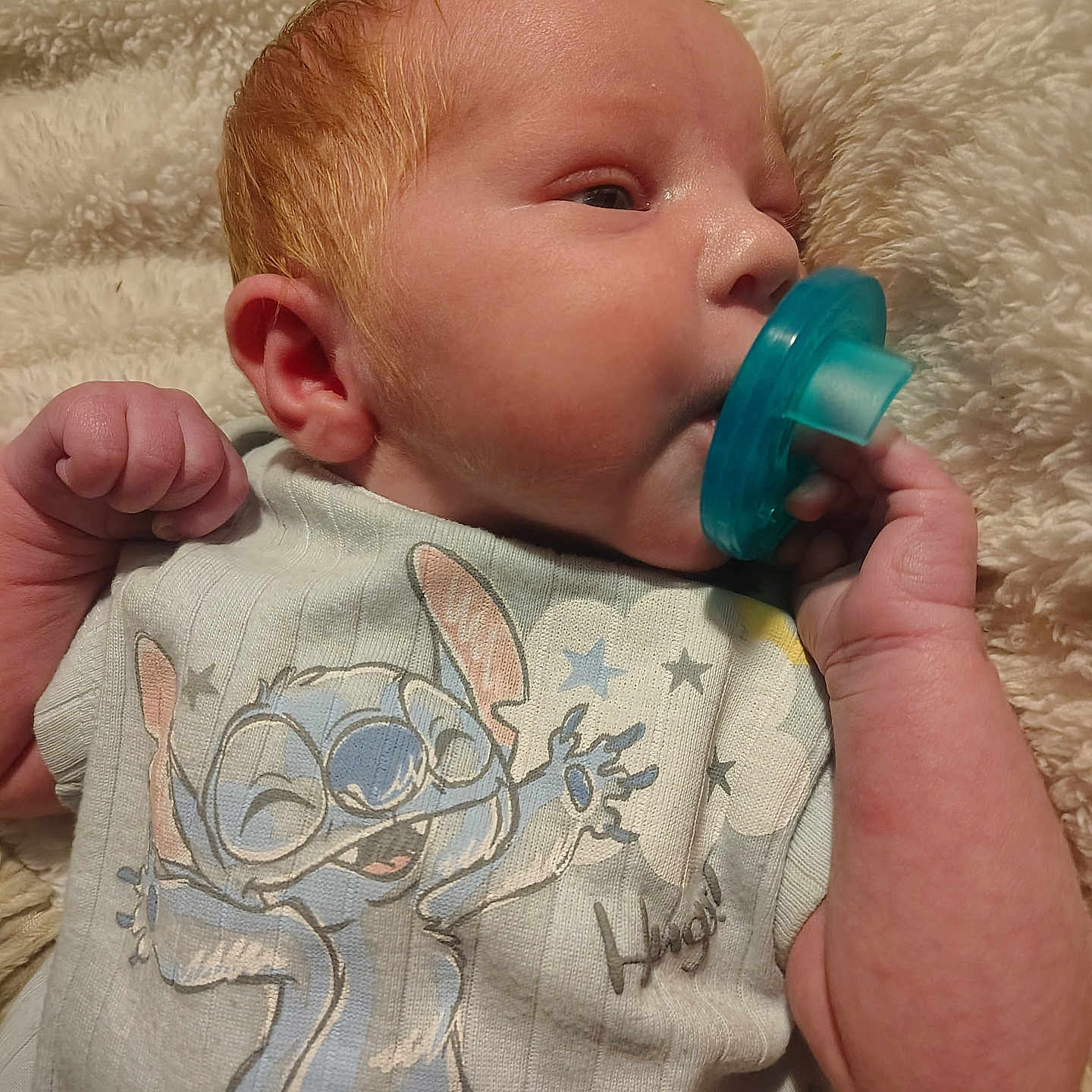 Adam joined the competition — help win amazing prizes! baby, infant, pacifier, red_hair, clothing, cartoon_character, blanket, soft_texture, sleepy, cute, hand, face, skin, indoors, portrait, newborn, baby_garment, comfort, resting, child