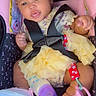 Amilliyan is registered to the contest to win money with this photo: baby, child, car_seat, headband, bow, dress, yellow, pacifier, bottle, shoes, straps, cute, infant, smiling, clothing, sitting, indoor, person, accessory, happy