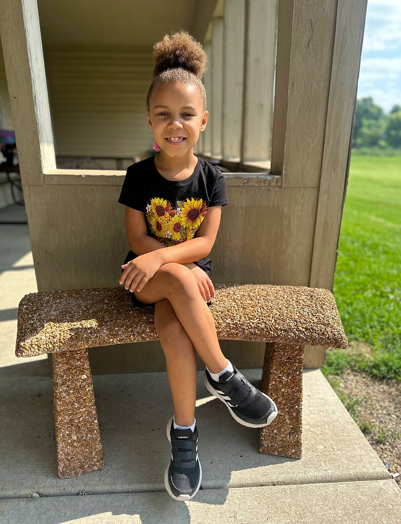Aubreigh is registered to the contest to win money with this photo: child, cool, eyewear, hairstyle, happy, joint, joy, knee, leg, leisure, person, plant, shoe, shoulder, smile, sneakers, standing, thigh, toddler, tree
