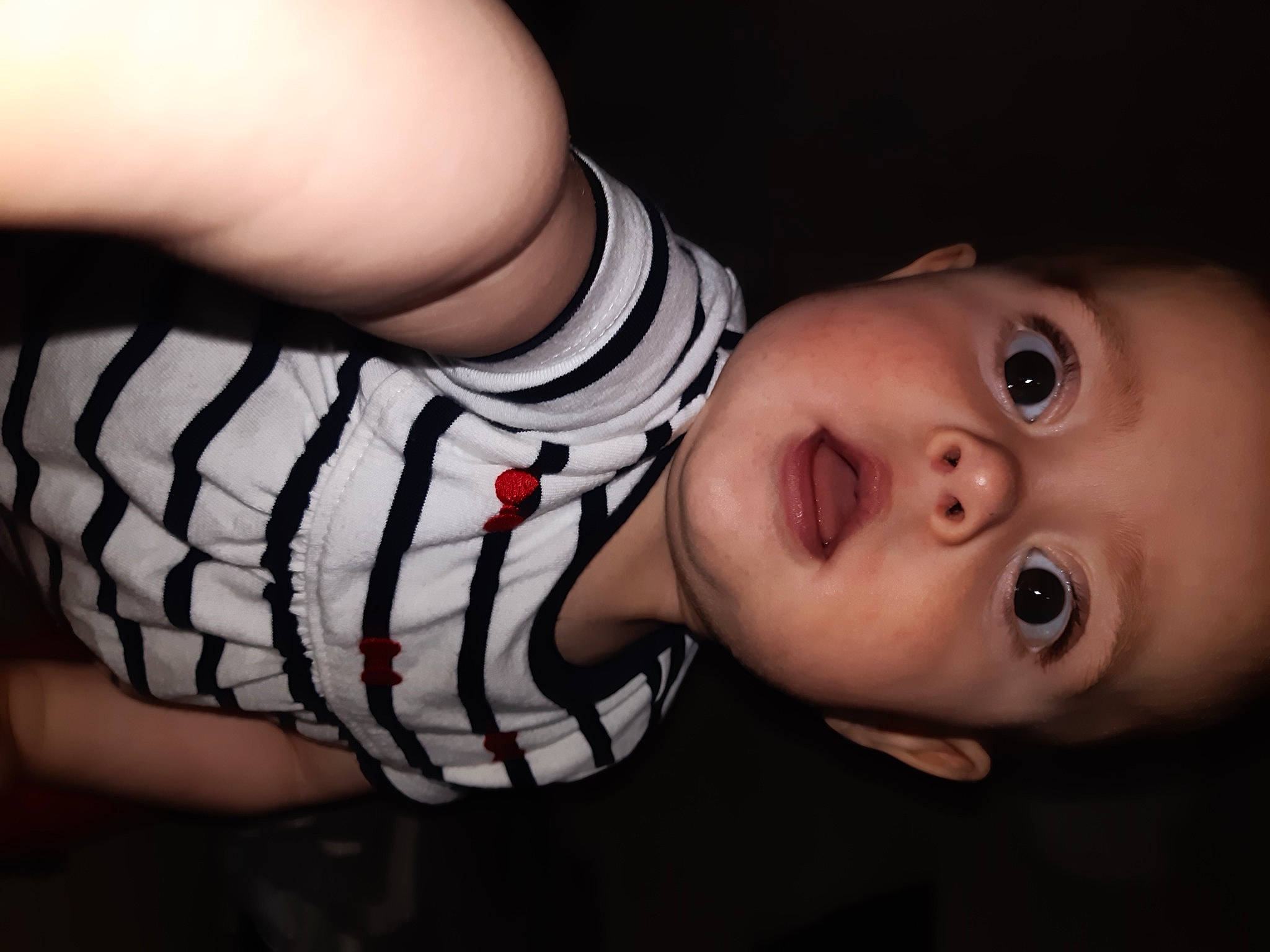 Ruby participe au concours pour gagner de l'argent avec cette photo : arm, baby, baby_toddler_clothing, cheek, elbow, eye, eyelash, finger, flash_photography, human_body, iris, lip, mouth, neck, nose, person, skin, sleeve, smile, surprise