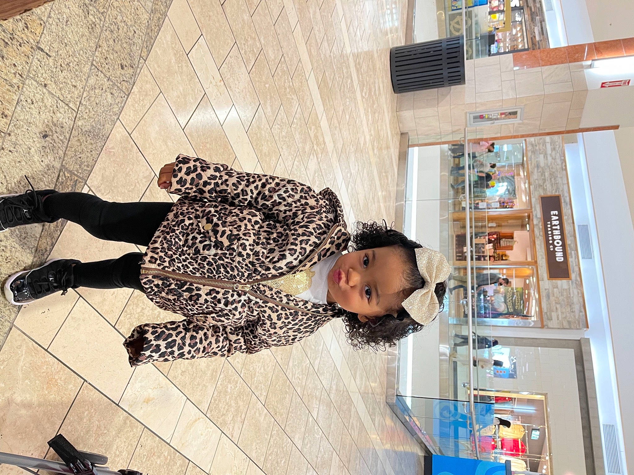 Alexandria is registered to the contest to win money with this photo: building, customer, engineering, eyewear, flooring, fun, human_leg, machine, pattern, person, retail, road_surface, room, shelf, shelving, sidewalk, street, street_fashion, thigh, visual_arts