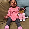 Paitynn joined the competition — help win amazing prizes! toddler, child, smiling, pink_clothing, headband, plush_doll, couch, cushion, indoor, happy, leggings, footwear, toy, person, sitting, cute, baby, portrait, home, cozy