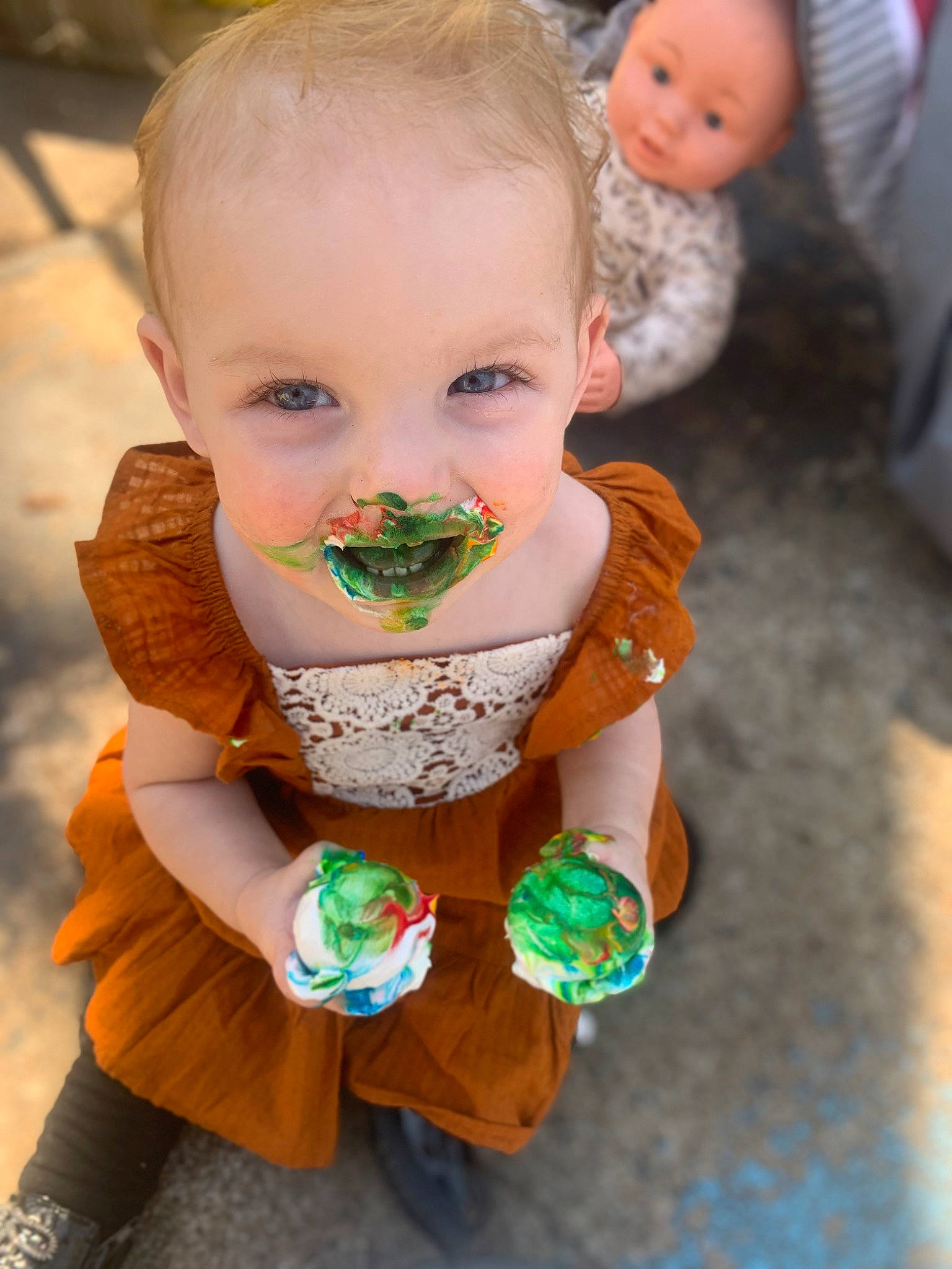 Eden joined the competition — help win amazing prizes! baby, beard, cheek, child, dress, finger, grass, hand, happy, iris, leisure, mammal, mouth, nose, orange, person, sitting, skin, toddler, toy