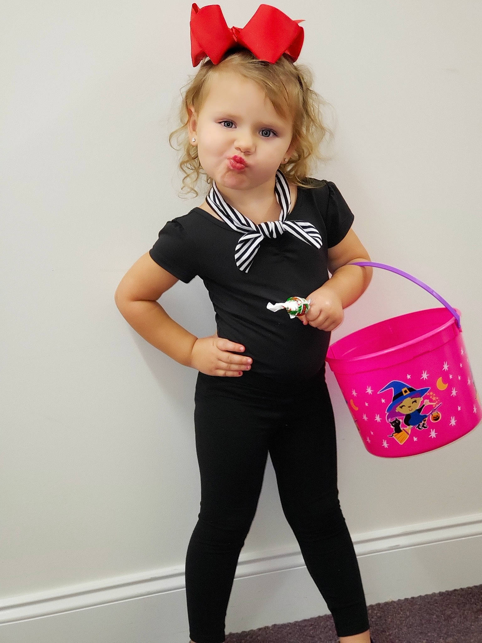 Ryker is registered to the contest to win money with this photo: abdomen, child, child_model, clothing, costume, fashion_accessory, joint, leg, leggings, person, pink, shoulder, sleeve, spandex, sportswear, standing, t_shirt, tights, toddler, trousers