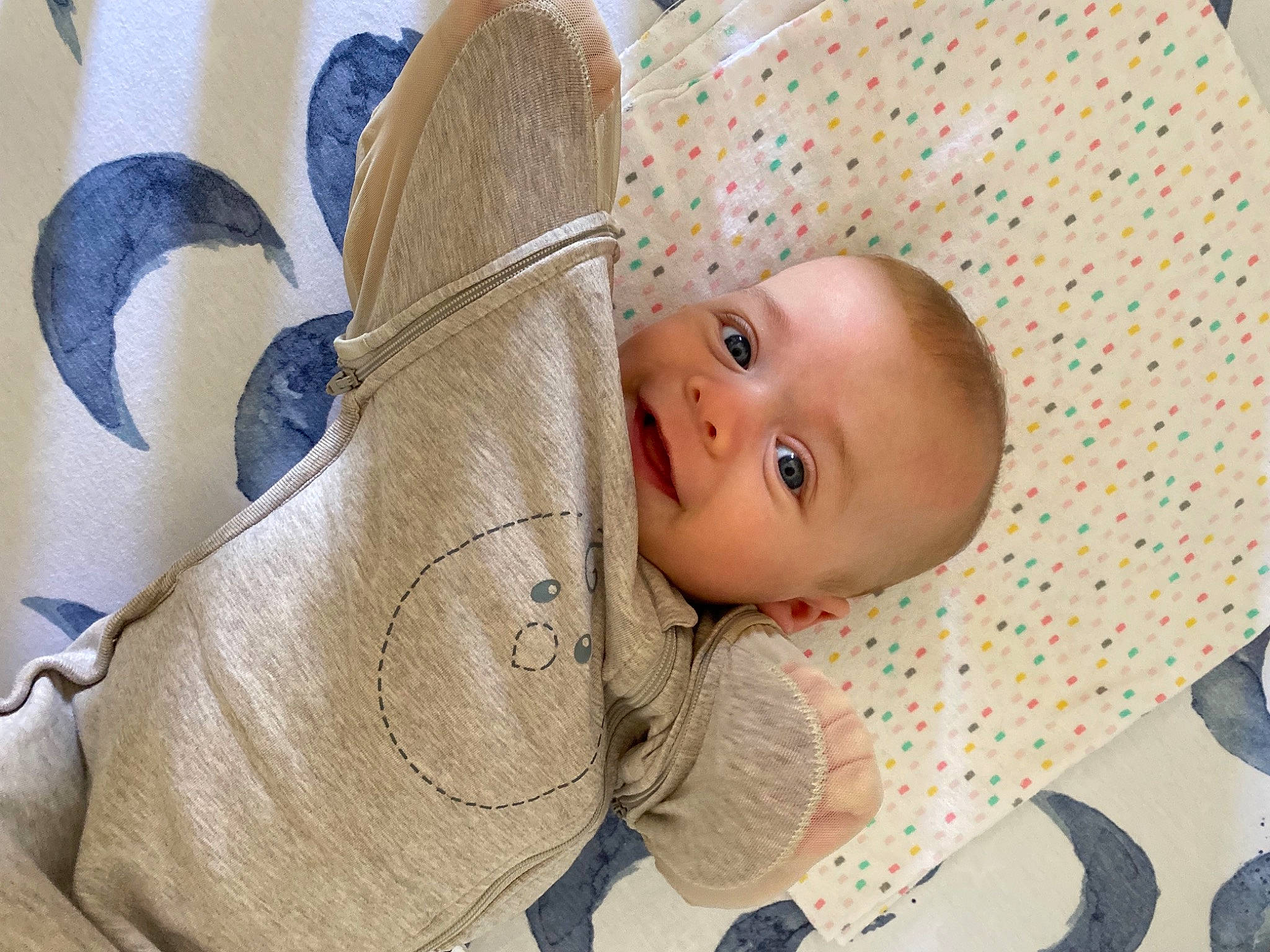 Caden is registered to the contest to win money with this photo: baby, baby_products, baby_safety, baby_sleeping, baby_toddler_clothing, cheek, child, comfort, fashion_accessory, gesture, hand, happy, infant_bed, linens, pattern, person, product, skin, smile, toddler