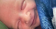 Blake joined the competition — help win amazing prizes! newborn, baby, smiling, blanket, blue, sleeping, face, closeup, child, infant, soft, cute, peaceful, wrapped, cozy, portrait, skin, tiny, resting, happy