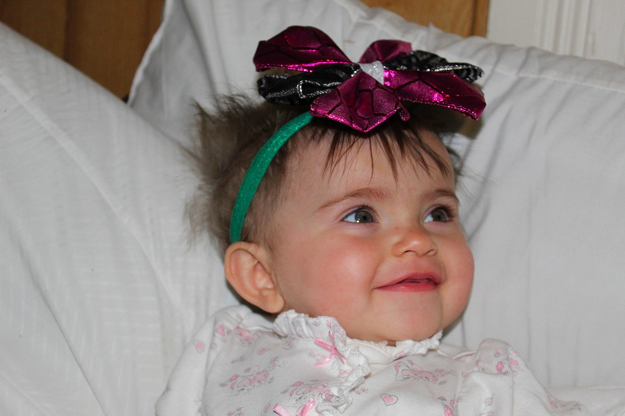 Linda is registered to the contest to win money with this photo: baby, child, clothing, costume_accessory, ear, fashion_accessory, hair_accessory, headband, headgear, headpiece, person, pink, toddler