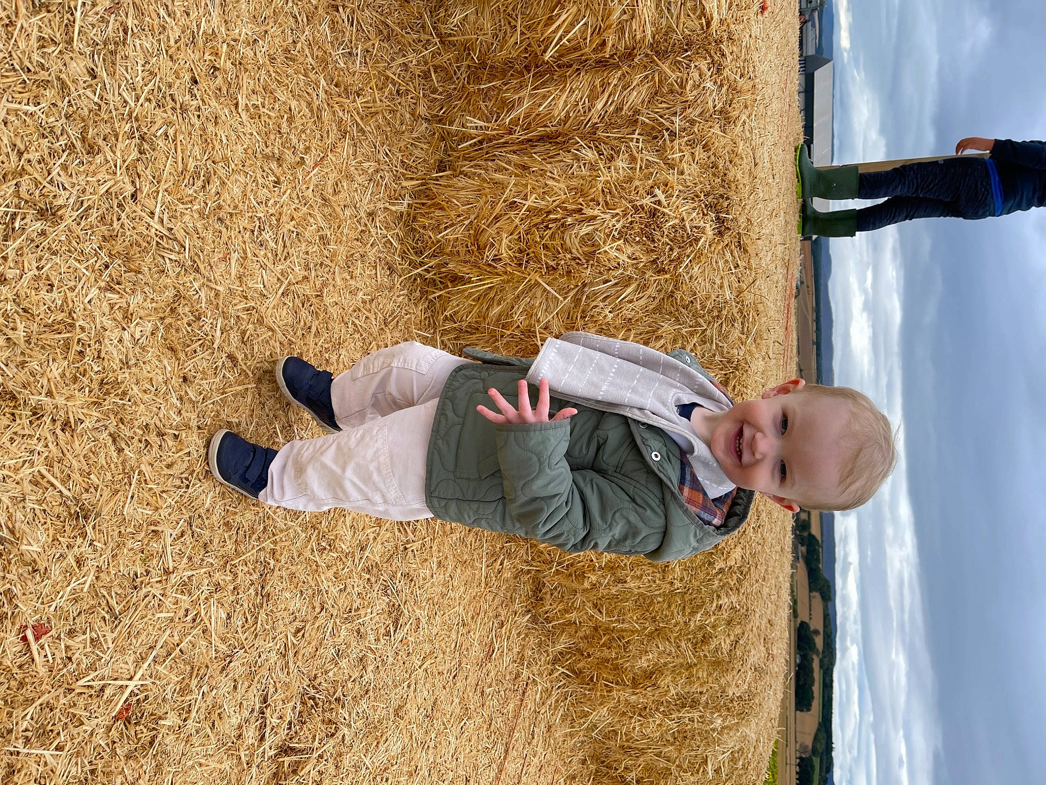 Louis joined the competition — help win amazing prizes! agriculture, child, cloud, fun, grass, happy, hay, joy, landscape, leisure, people_in_nature, person, shadow, sitting, sky, smile, soil, straw, toddler, tree