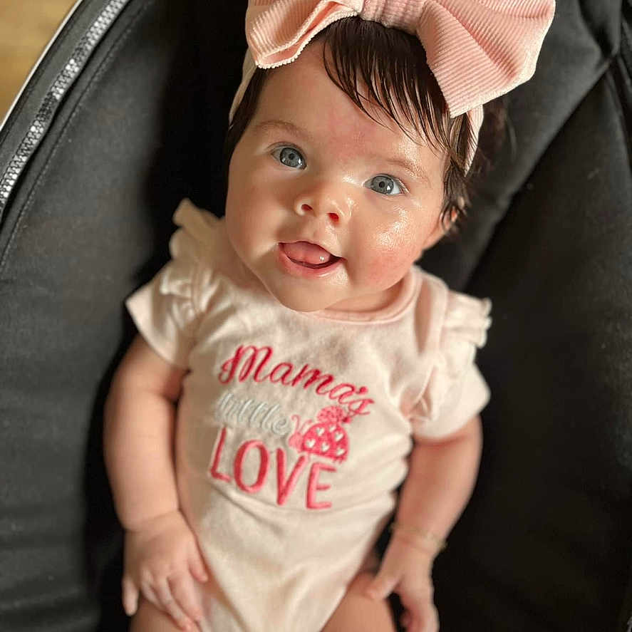 Nylah joined the competition — help win amazing prizes! accessories, baby, baseballcap, cap, clothing, couch, cushion, dress, face, furniture, happy, hat, head, homedecor, newborn, person, photography, portrait, smile, t_shirt
