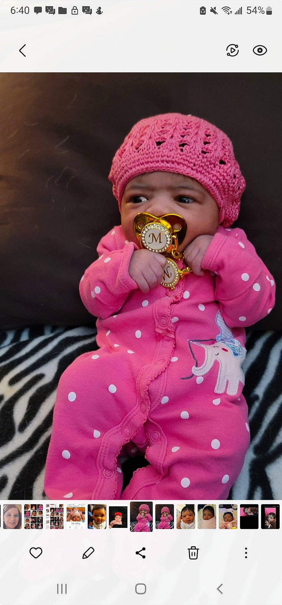 Chanel Rose joined the competition — help win amazing prizes! baby, baby_products, baby_toddler_clothing, beanie, cap, child, clothing, face, fashion_accessory, happy, joy, knit_cap, magenta, outerwear, pattern, person, pink, sitting, sleeve, textile