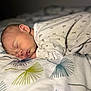 Noémie a rejoint le concours — aidez-le/la à gagner de superbes lots ! newborn, baby, sleeping, bed, blanket, onesie, infant, pattern, cozy, rest, face, peaceful, cute, soft, indoor, portrait, child, young, skin, head