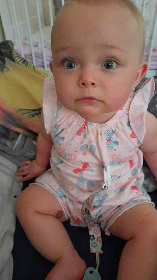 Annalise joined the competition — help win amazing prizes! baby, baby_toddler_clothing, cheek, chest, comfort, eyelash, finger, fun, happy, iris, lip, mouth, neck, nose, person, pink, sitting, skin, sleeve, toddler