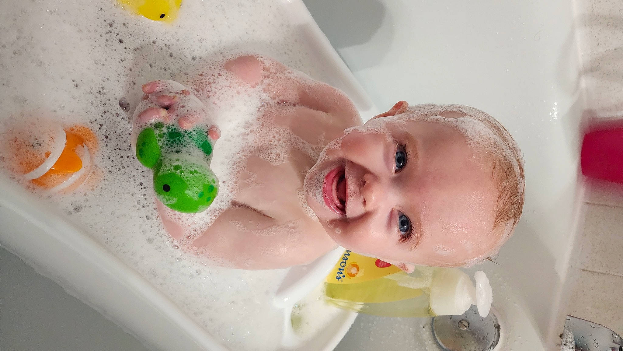 Sophie joined the competition — help win amazing prizes! baby, baby_bathing, baby_laughing, bathing, bathroom, bathtub, cheek, ear, eyelash, face, fluid, foam, happy, liquid, person, plumbing, plumbing_fixture, skin, smile, toddler