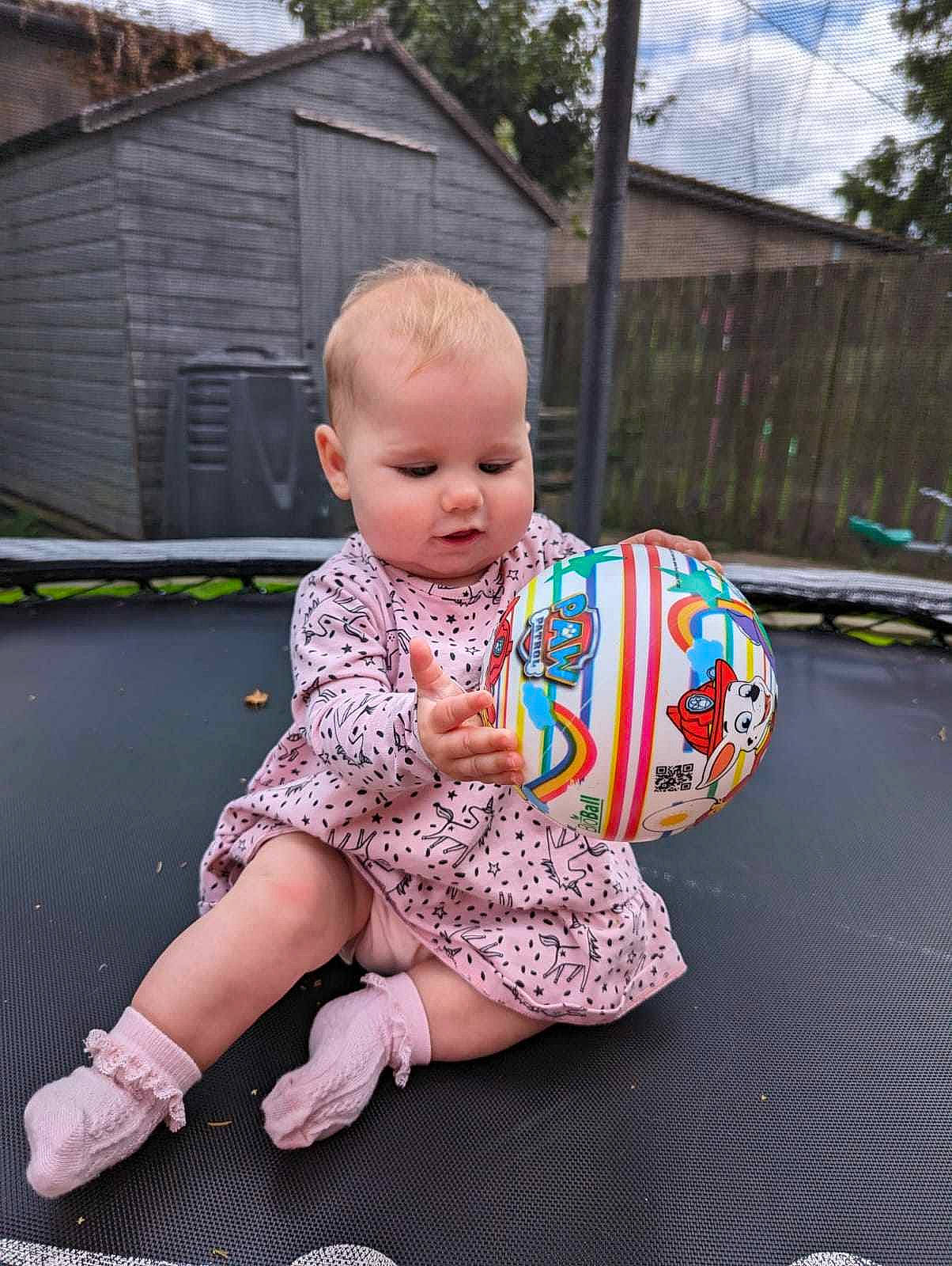 Freya joined the competition — help win amazing prizes! baby, baby_toddler_clothing, child, cloud, flooring, foot, fun, grass, happy, human_leg, knee, leisure, pattern, person, pink, recreation, sitting, sky, sleeve, toddler