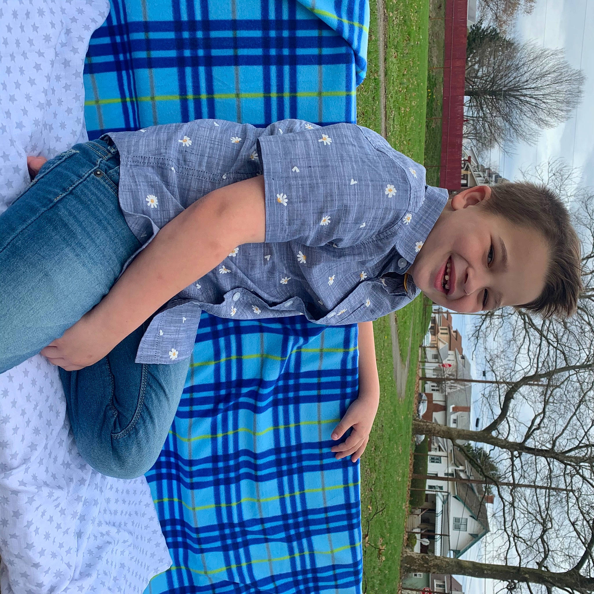 Paxton is registered to the contest to win money with this photo: child, design, joy, pattern, person, plaid, tartan, textile