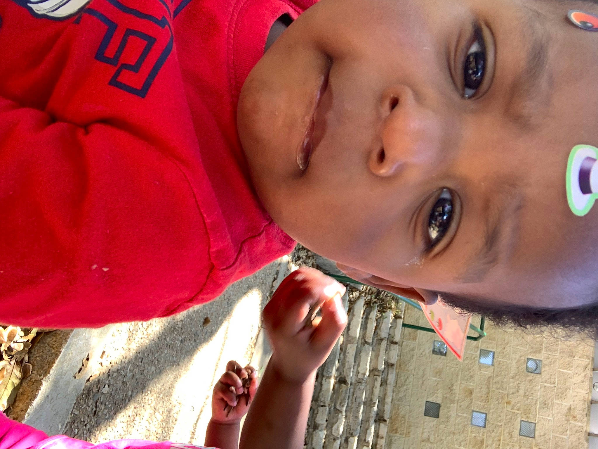 Aiden is registered to the contest to win money with this photo: cheek, child, eyelash, finger, fun, grass, happy, hat, human_body, lip, mouth, neck, nose, pattern, people_in_nature, person, photograph, red, skin, smile