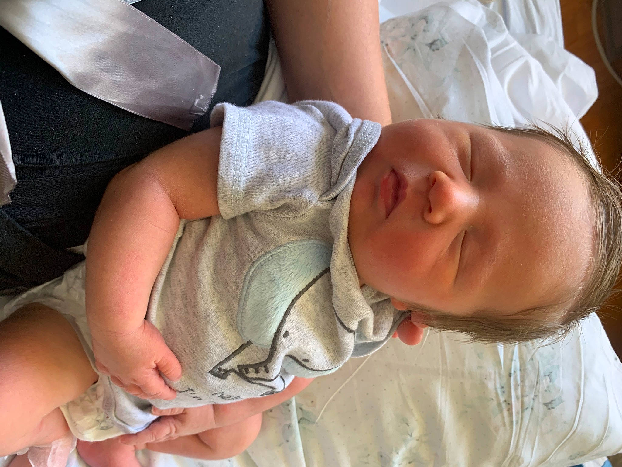 Titan is registered to the contest to win money with this photo: arm, baby, birth, child, childbirth, hand, person, sleep